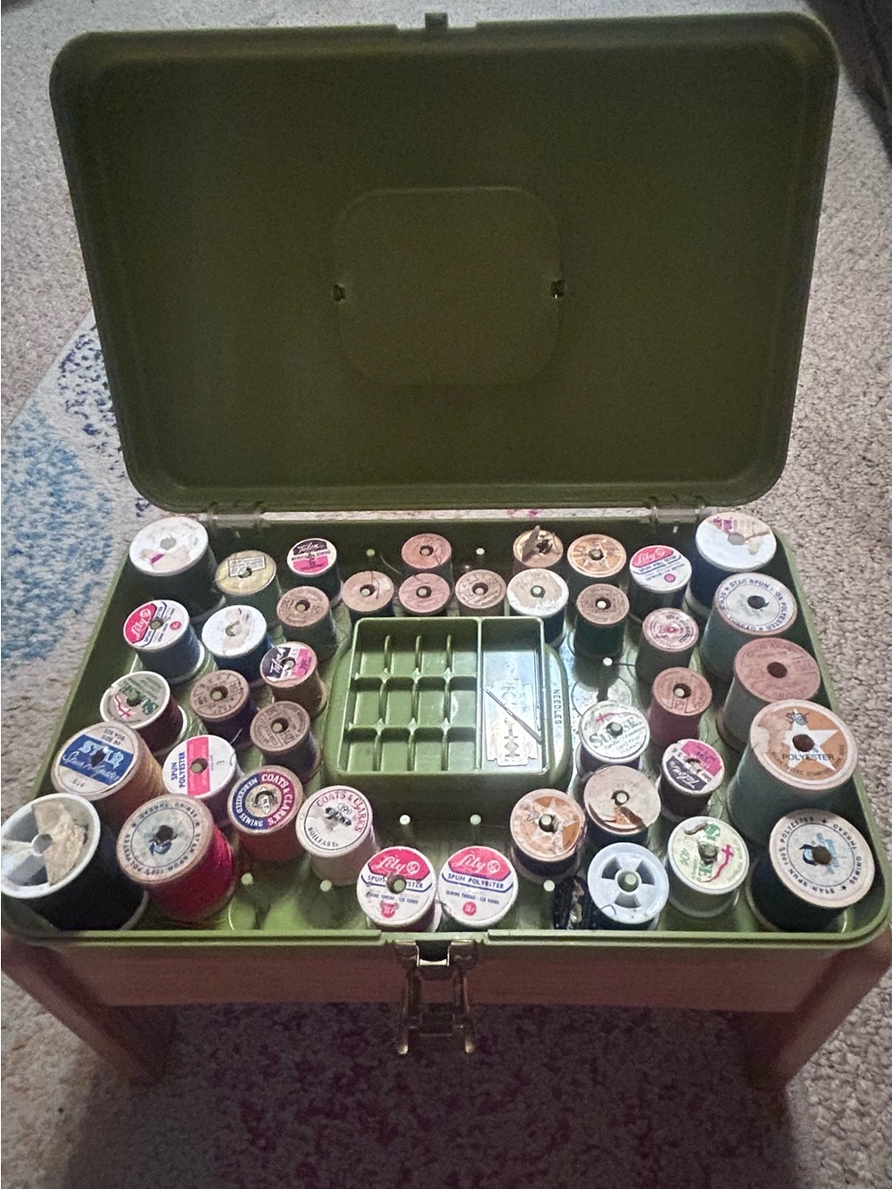 Vintage Green Metal Sewing Box with Assorted Wooden and Plastic Thread Spools